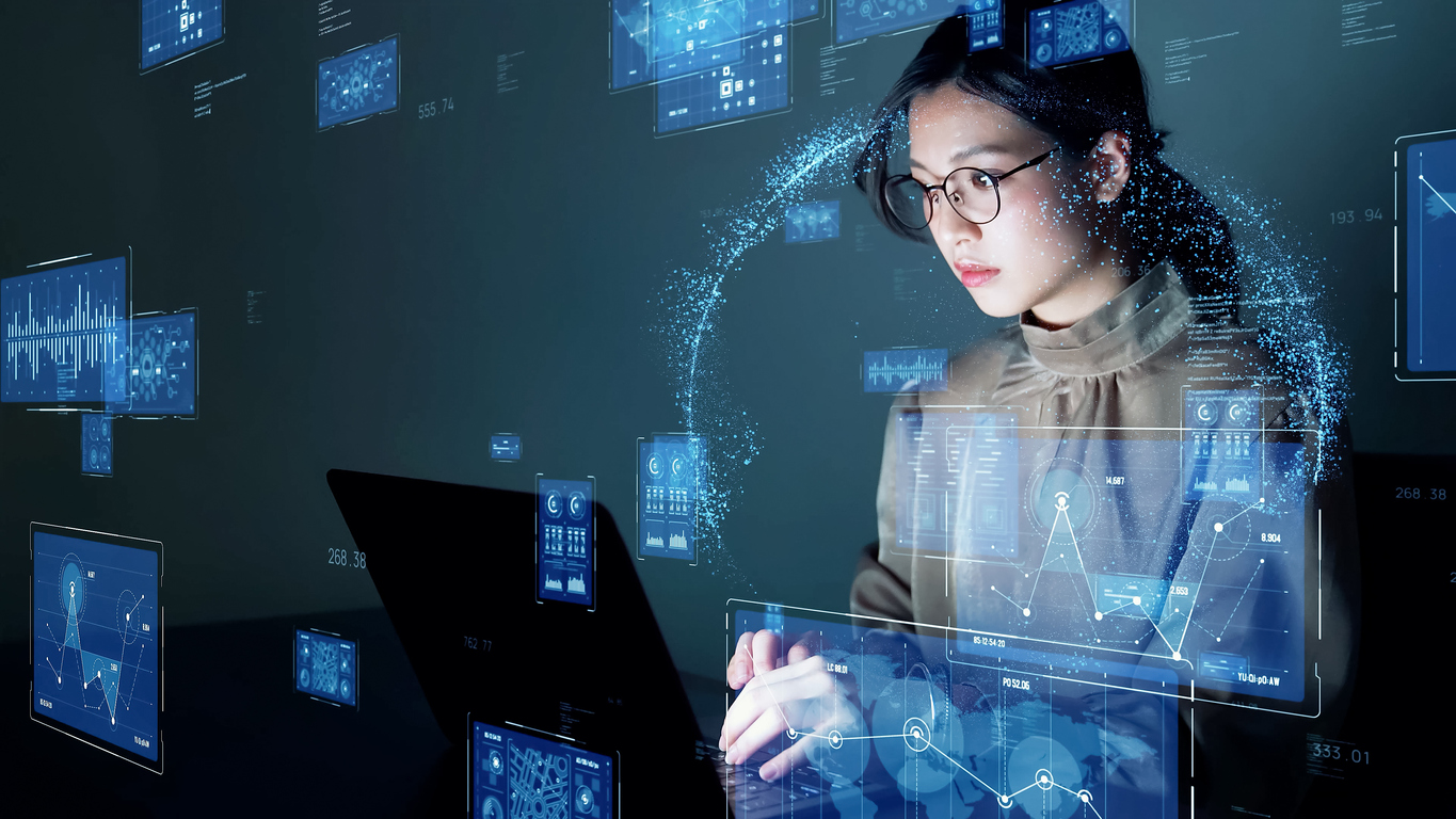 Young asian woman watching hologram screens. Business technology.